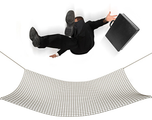 Businessman falling into a safety net on a white background