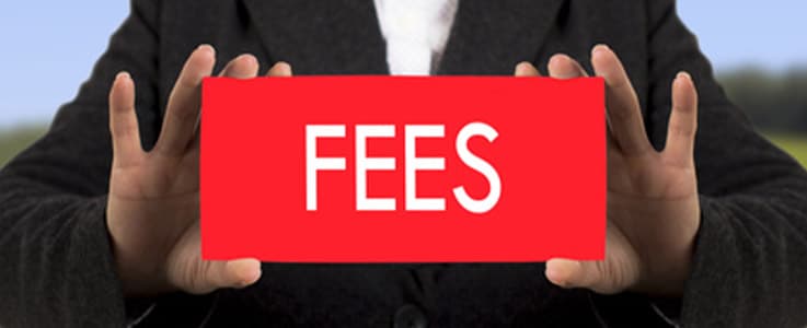 businessman holding red fees sign