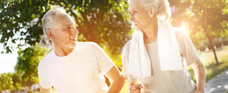 retired couple exercising outside