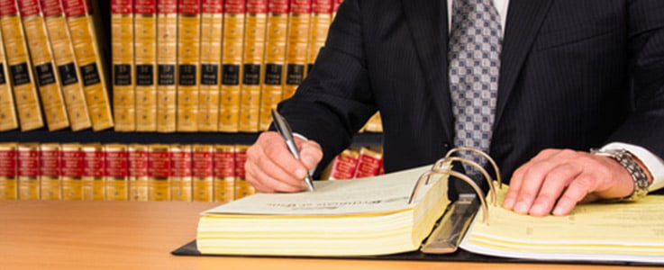 lawyer working near law books