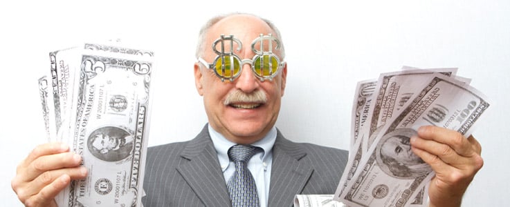retired man holding cash wearing money glasses