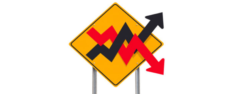 volatile stock market arrows road sign