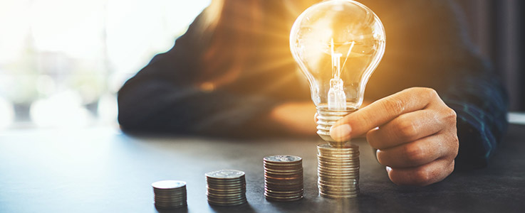 coin stacks with light bulb idea