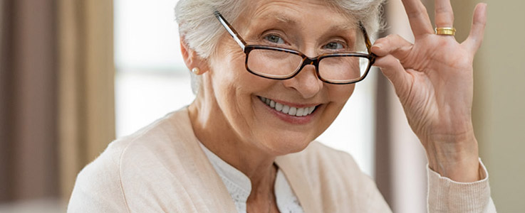 happy retired woman with glasses