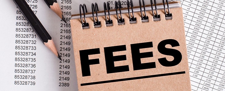 fees notebook on financial spreadsheets