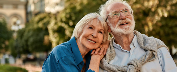 happy retired couple outside