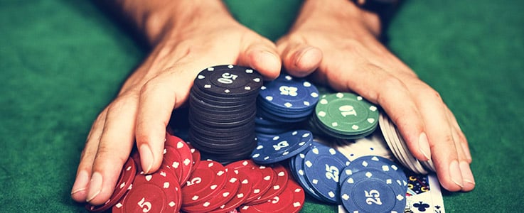man betting all poker chips