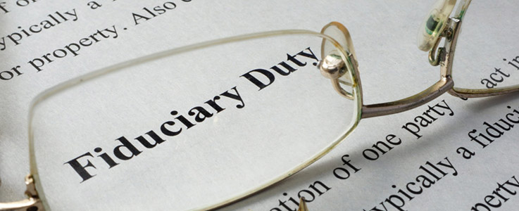 fiduciary duty text magnified by glasses