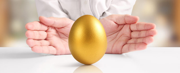 hands presenting golden egg